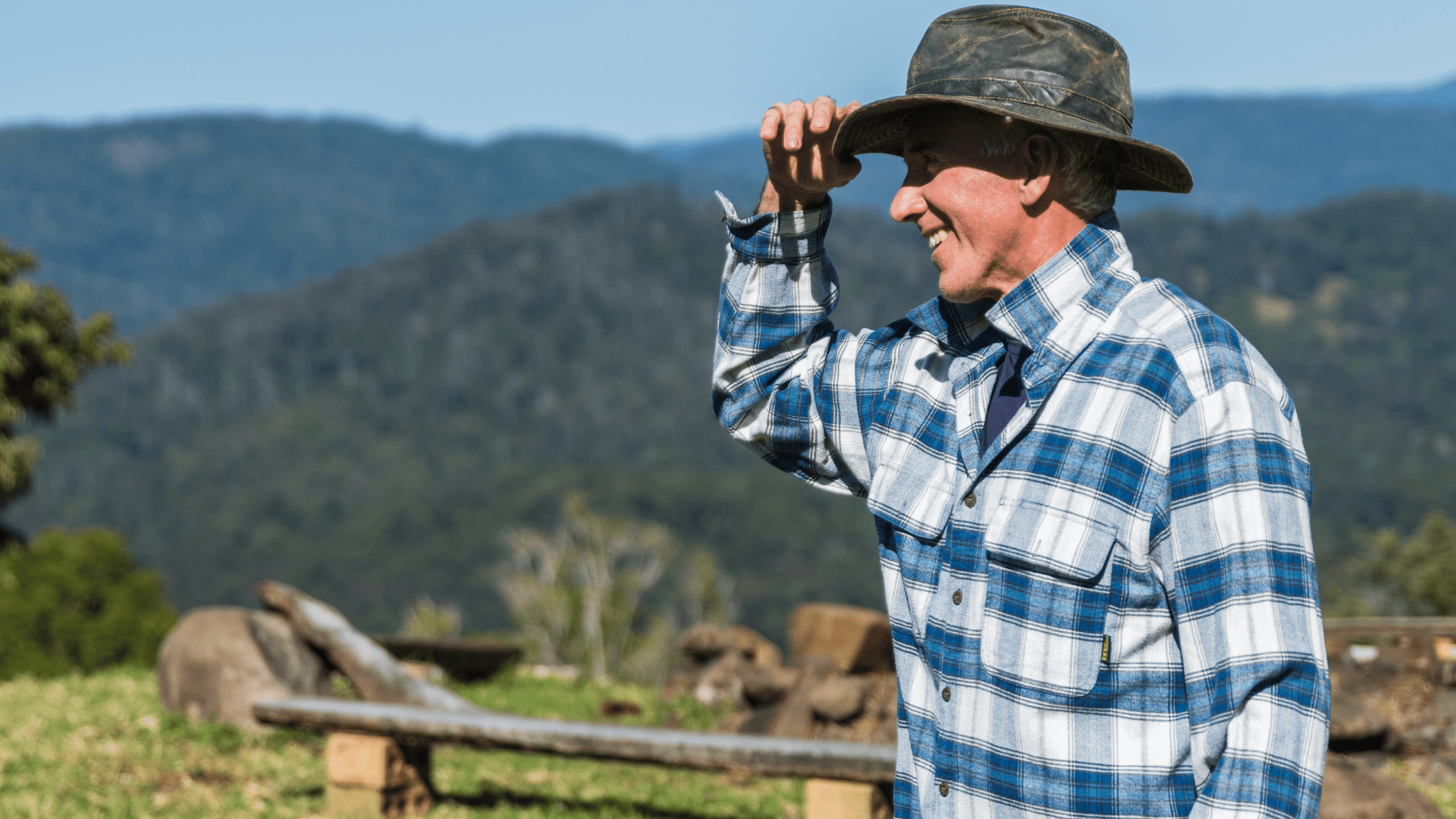 Happy farmer tipping hat